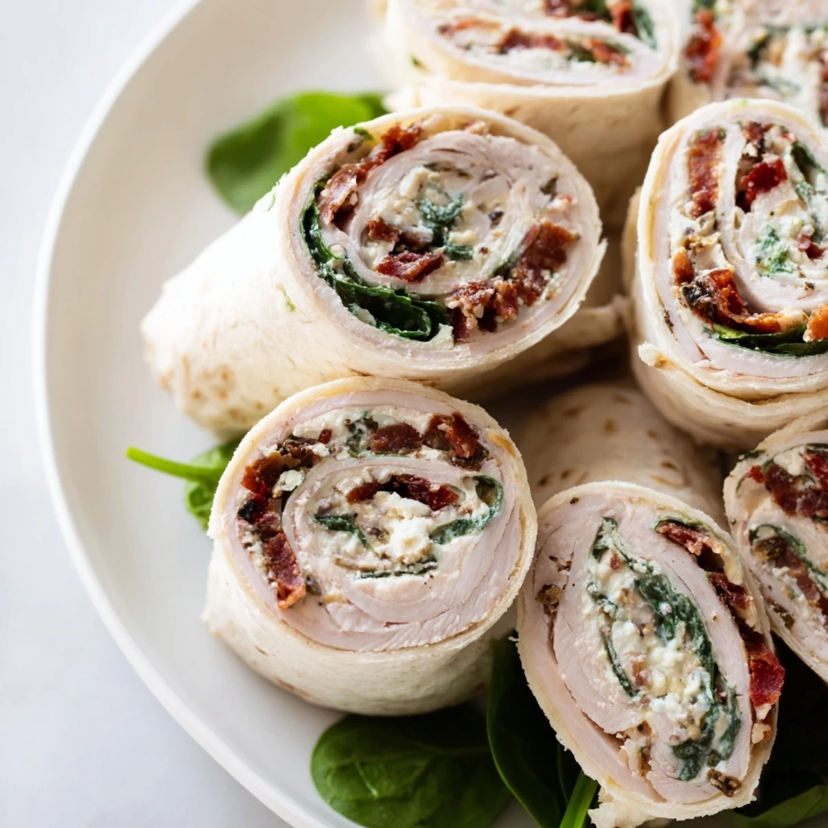 These vibrant sun-dried tomato turkey roll-ups are bursting with flavor, ready to eat, a quick Italian meal.
