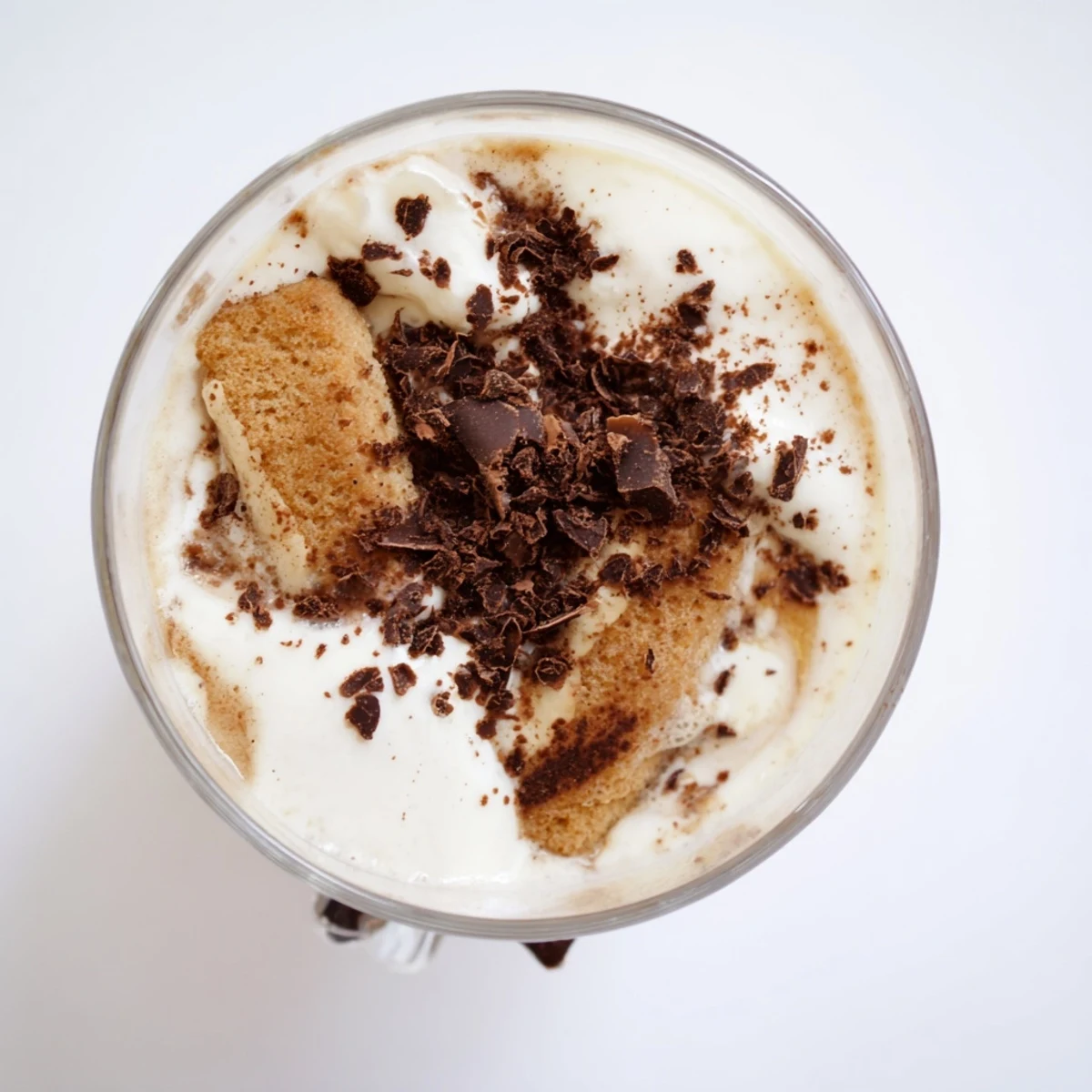 A creamy Tiramisu Latte topped with cocoa powder, a decadent and delightful coffee treat.