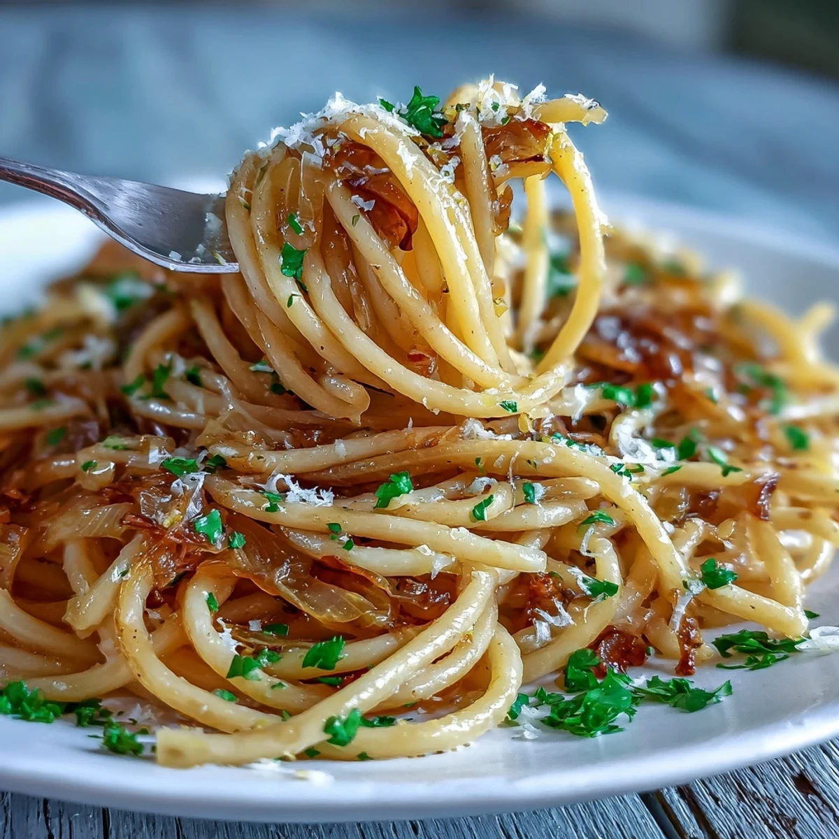 A skillet of Cabbage Pasta With Garlic and Parmesan, finished with grated Parmesan, ready for a weeknight vegetarian dinner.
