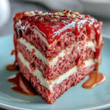 Elegant pink rosé velvet cake with luscious frosting and shimmering gold drip finish.