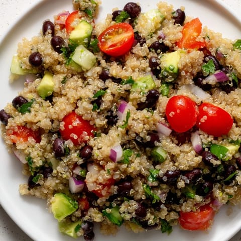 This vibrant Quinoa Black Bean Salad features cooling cucumber and avocado ready to eat.