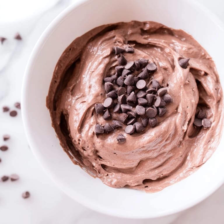 A creamy dish of gluten-free Brownie Batter Dip, perfect for parties, with a deep cocoa hue.