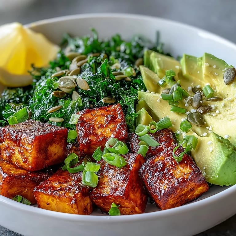 Enjoy a colorful Tofu Breakfast Bowl featuring crispy turmeric tofu, bright kale, and fresh avocado for a healthy morning meal.