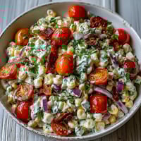 Creamy Corn Salad with Jalapeño, a vibrant summer side with sweet corn, red peppers, and a tangy lime dressing.